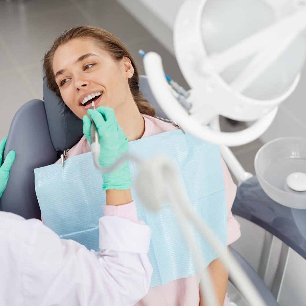 young-woman-at-dental-exam-3XD85GH.jpg